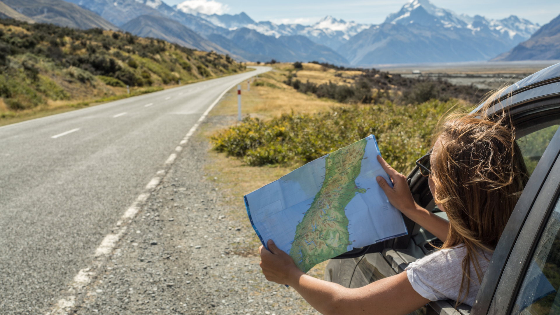 Women in car checking map
